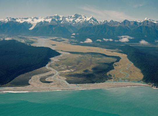 	Cook River mouth, Alpine Fault, Fox Glacier, Mount Tasman, and Aoraki/Mount Cook distant.