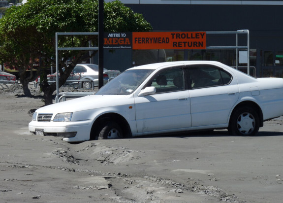 Car trapped by liquefaction Ferrymead Christchurch after Christchurch Earthquake 2011