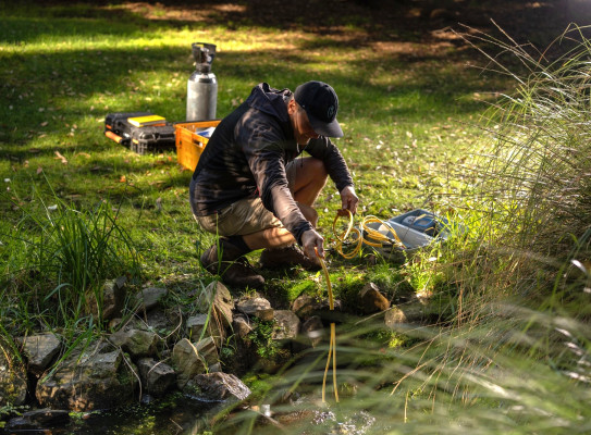 Programme co lead Uwe Morgenstern sampling a spring credit Earth Sciences New Zealand