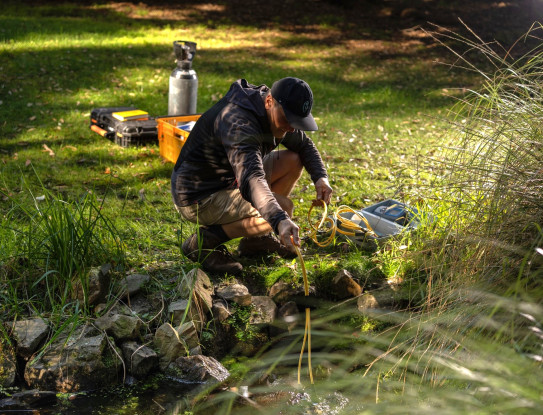Programme co lead Uwe Morgenstern sampling a spring credit Earth Sciences New Zealand
